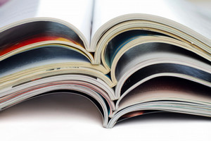 a stack of open journals